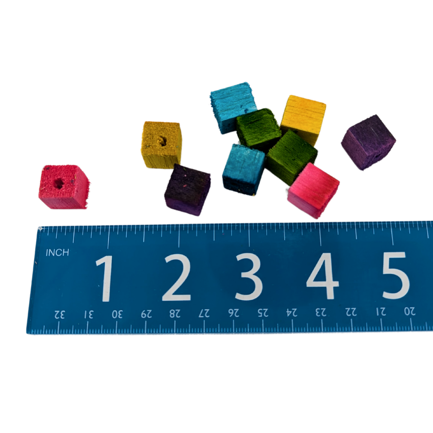 Mini half inch balsa cubes for toy parts, by Lil Monsters Bird Toys, shown next to ruler for scale
