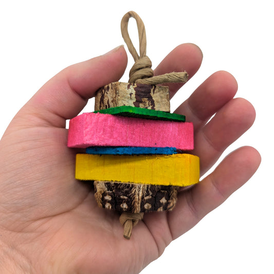 Baby by Lil Monsters Bird Toys. Held in hand for scale.