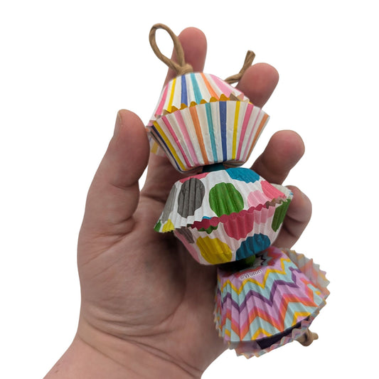 Balsa Surprise by Lil Monsters Bird Toys. Held in hand for scale and to show a different color variation.