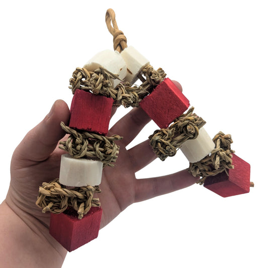 Candy Stripes by Lil Monsters Bird Toys. Held in hand to show scale.