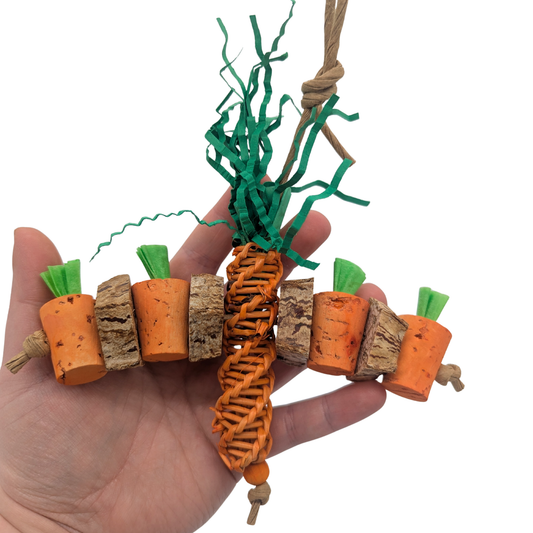 Carrot Patch by Lil Monsters Bird Toys. Held in hand for scale.