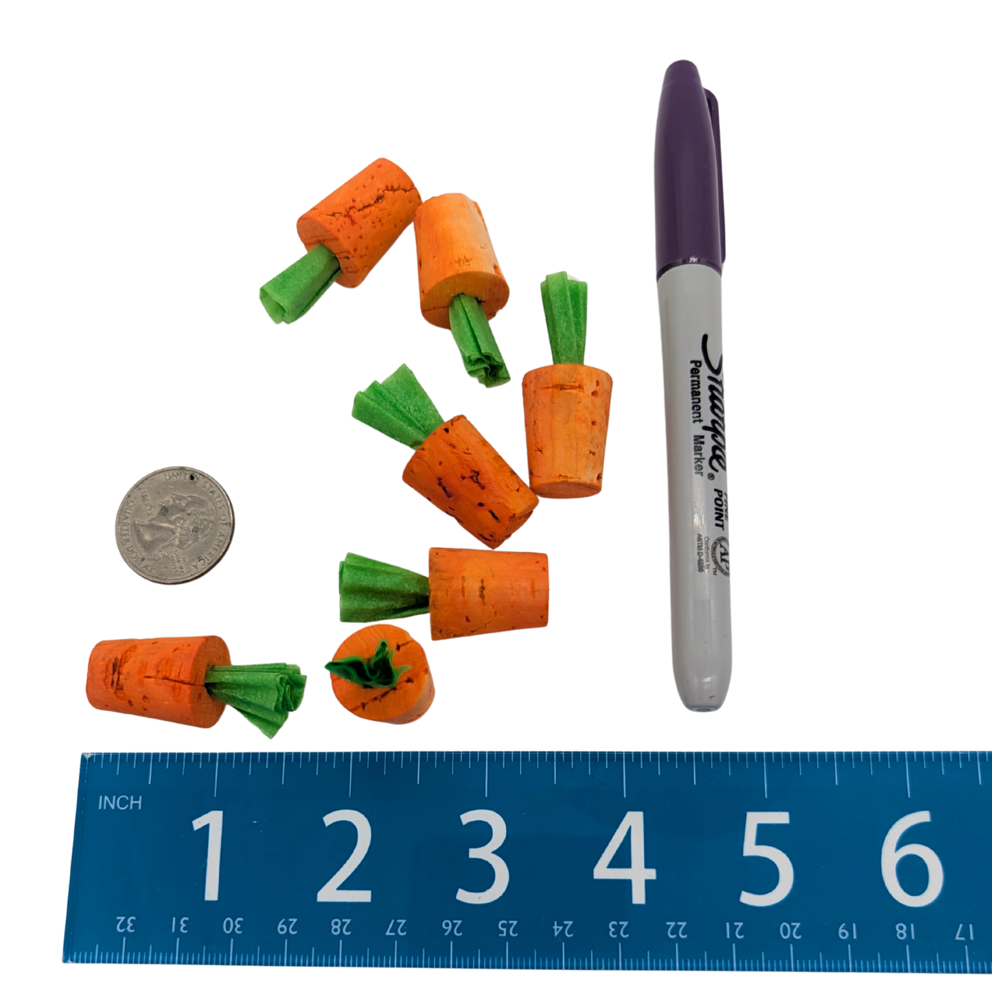Cork Carrot Refills bird toy by Lil Monsters Bird Toys next to a sharpie, ruler, and US quarter for scale