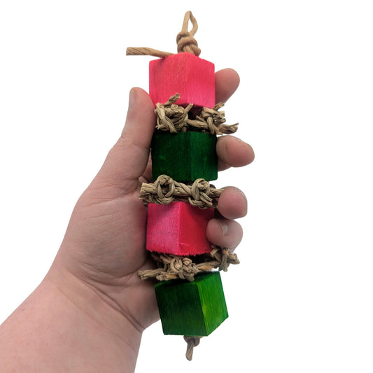 Crunchy by Lil Monsters Bird Toys. Held in hand to show scale.