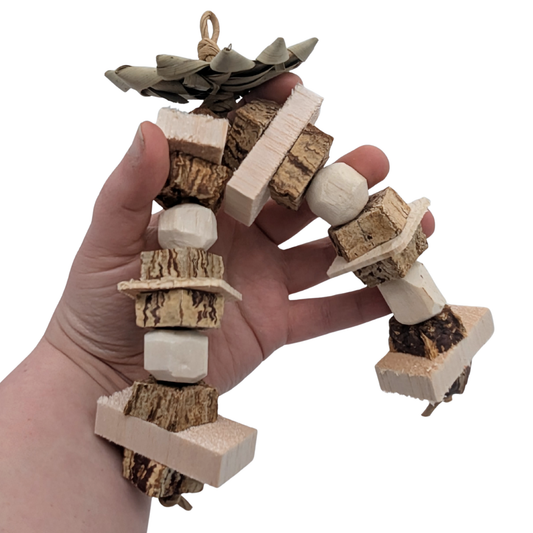 Hazel by Lil Monsters Bird Toys. Held in hand for scale.