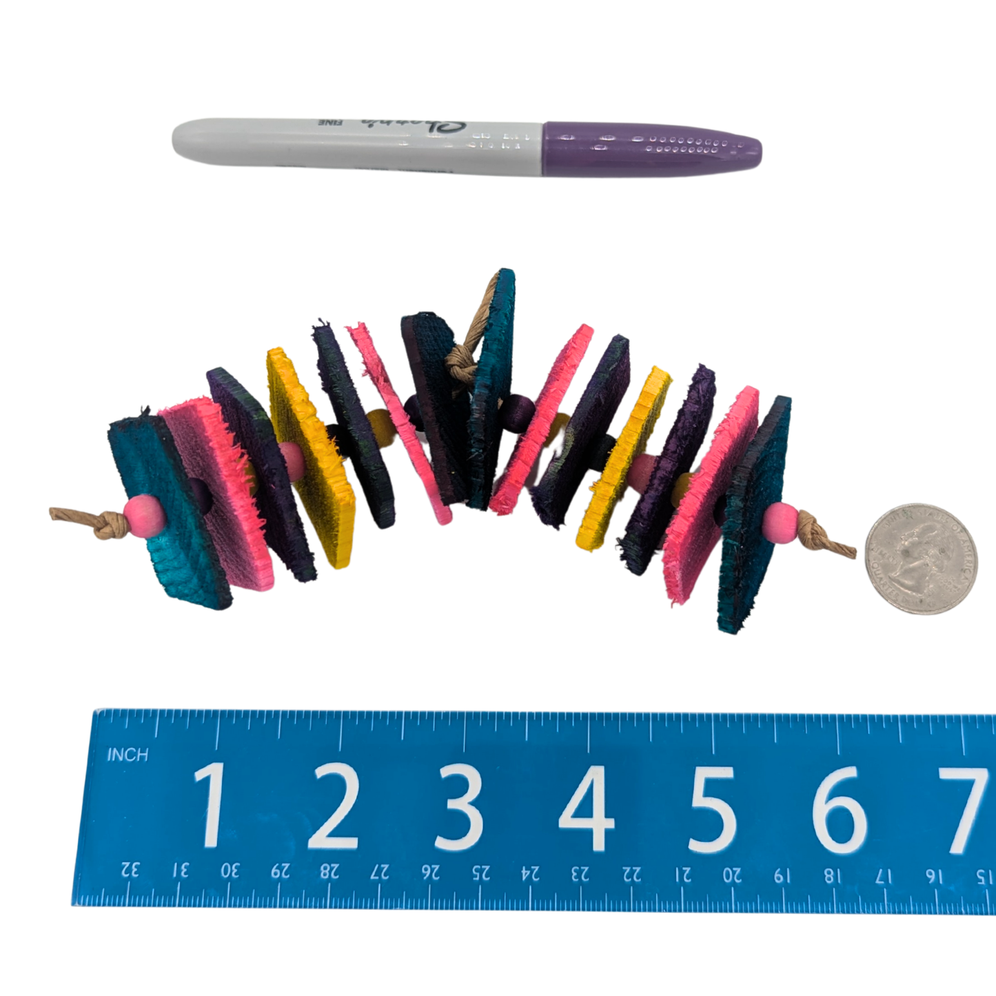 Itty Bitty Chippy by Lil Monsters Bird Toys. The Less beads variant next to a ruler, US quarter, and sharpie marker for scale.