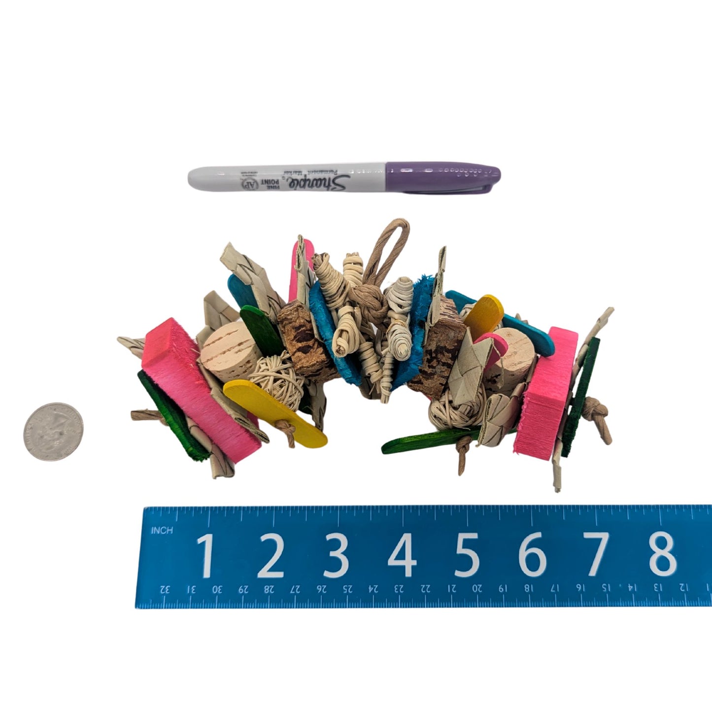 Koopa by Lil Monsters Bird Toys, next to a sharpie marker, US quarter, and ruler for scale.