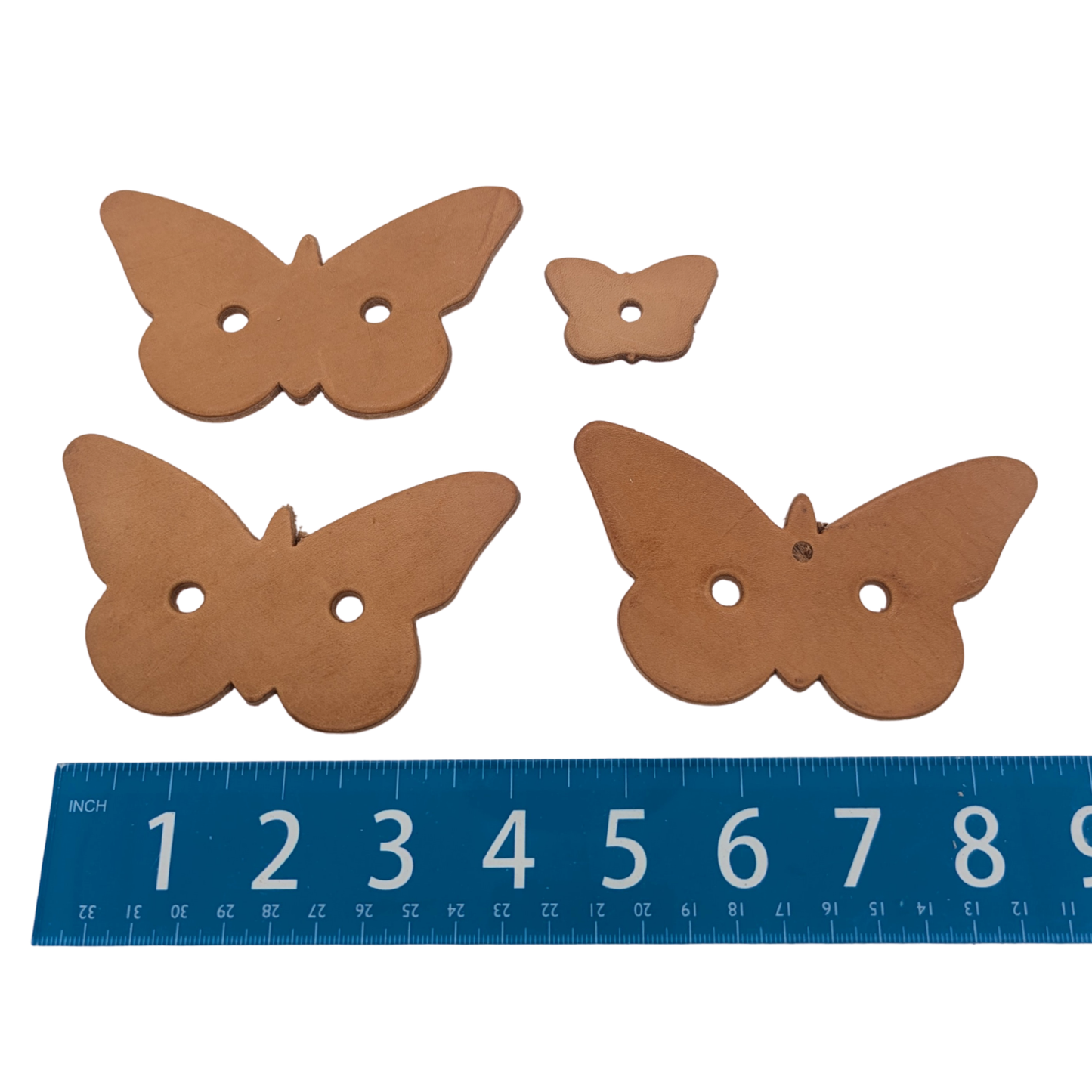 Leather Butterfly Shapes (Pack of 4) by Lil Monsters Bird Toys, next to ruler for scale