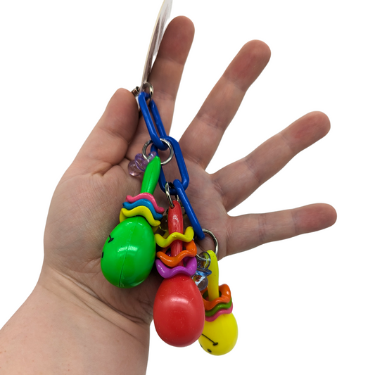 Maraca Mania small parrot toy by Super Bird Creations, in hand for scale
