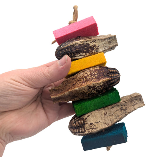 Mocha by Lil Monsters Bird Toys. Held in hand to show scale.