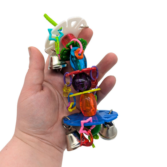 Shimmy by Lil Monsters Bird Toys. Held in hand for scale.