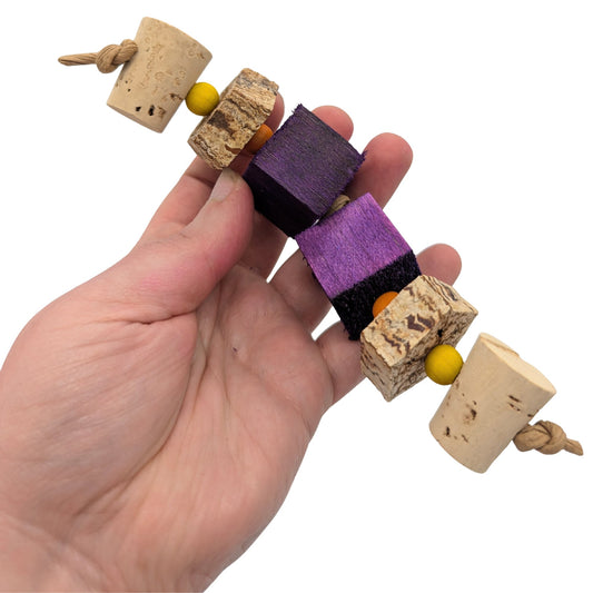 Trio by Lil Monsters Bird Toys. Shown held in hand for scale