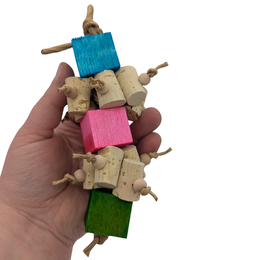 Uncorked by Lil Monsters Bird Toys. Shown in a colored variant, in hand for scale.