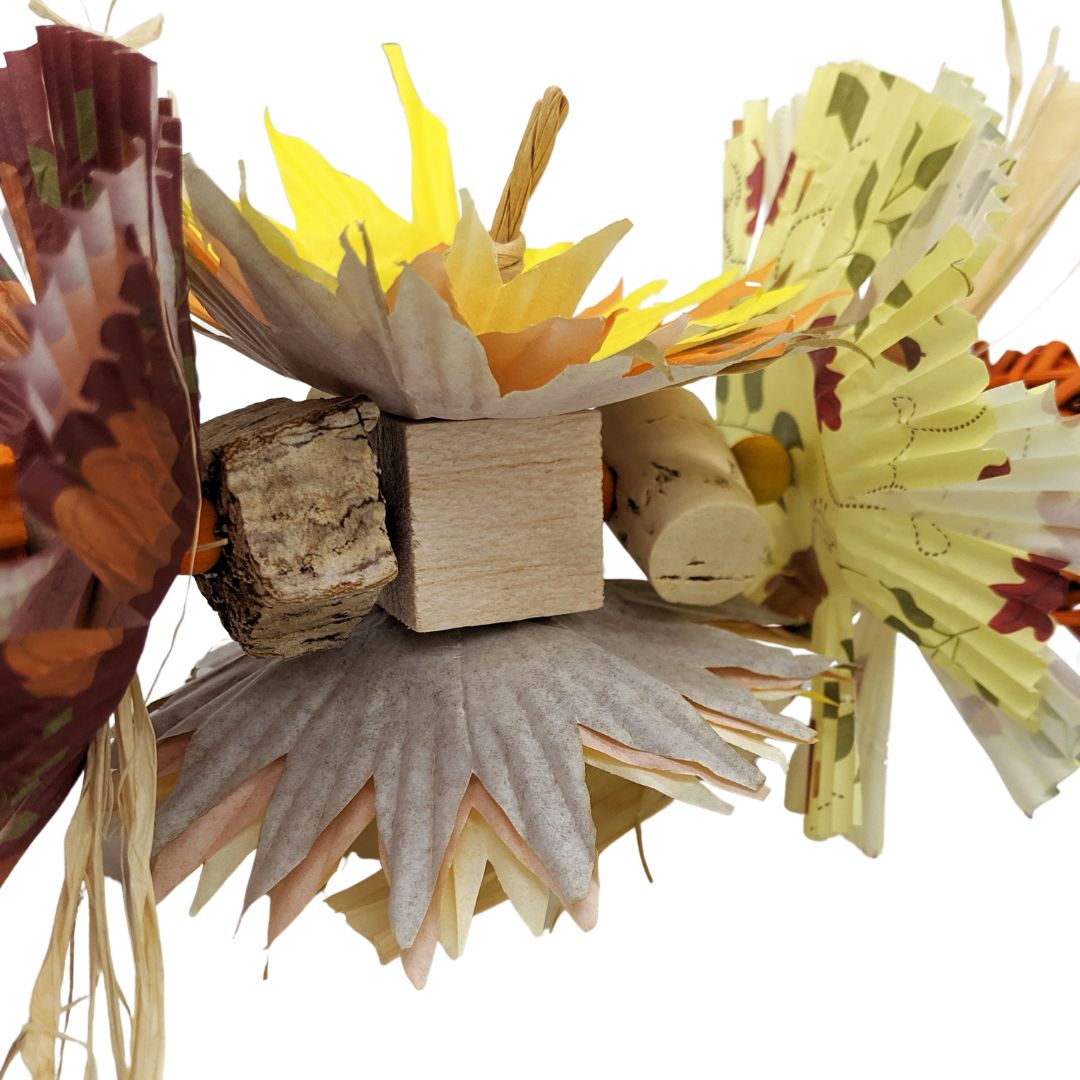 Mahogany pod, cork, and balsa are hiding among cupcake paper sunflowers.