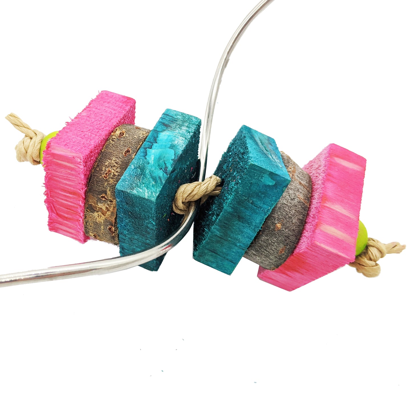 A small toy on a skewer. Strung on paper rope, 4 pieces of 1/2" pine, with cottonwood coins sandwiched between them.