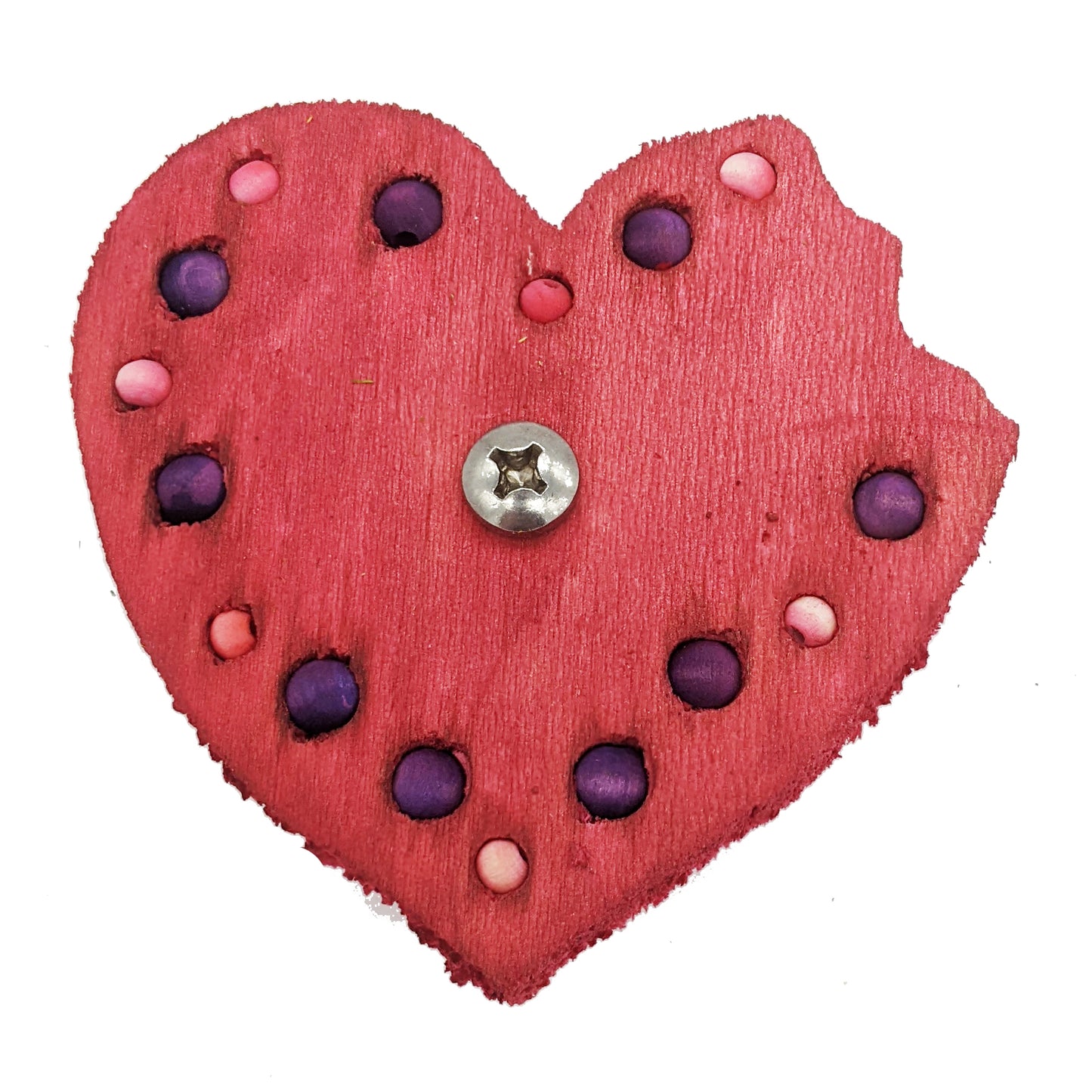 A heart shaped piece of balsa with a "bite" taken out of the right lobe. Embedded with 8mm and 6mm beads around the border.