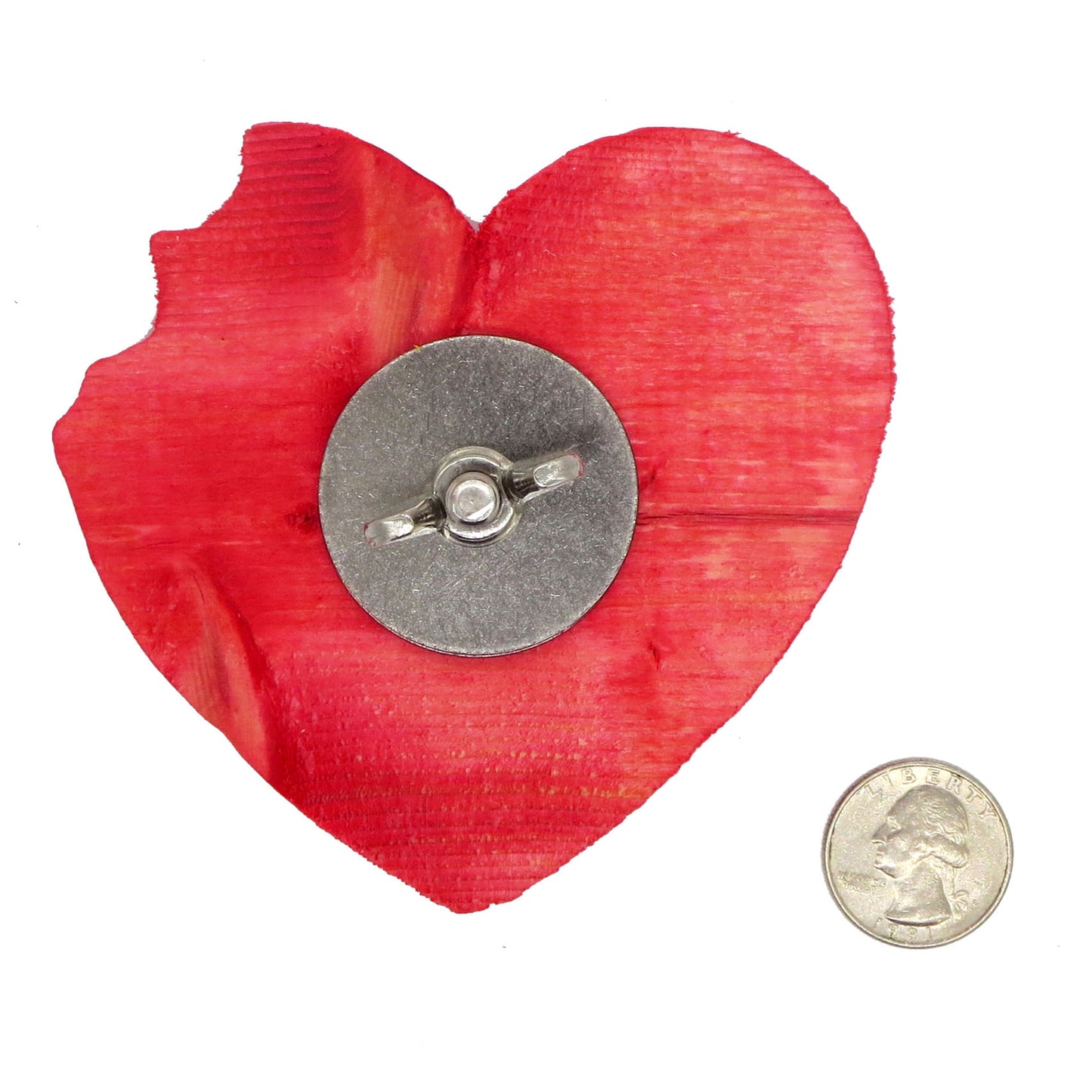 A heart shaped piece of pine with a "bite" taken out of the right lobe. Flipped over to shown the back with stainless style hardware.