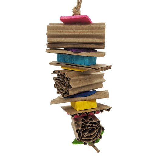 A bird toy made up of corrugated cardboard rolls, alternating with thin pine and balsa slices.