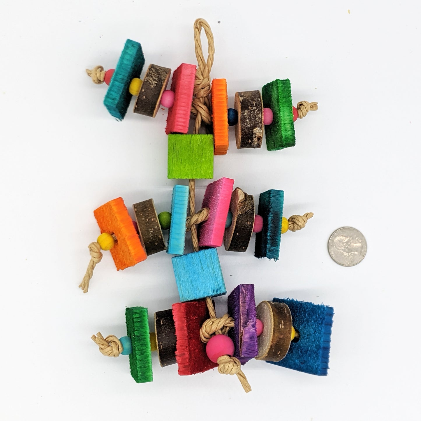 A bird toy for birds that love wood! Alternating pieces of 1/4" thin pine cut against the grain with pieces of natural willow or cottonwood slices. Wooden beads between the slices of wood, and balsa blocks between the levels of the toy.