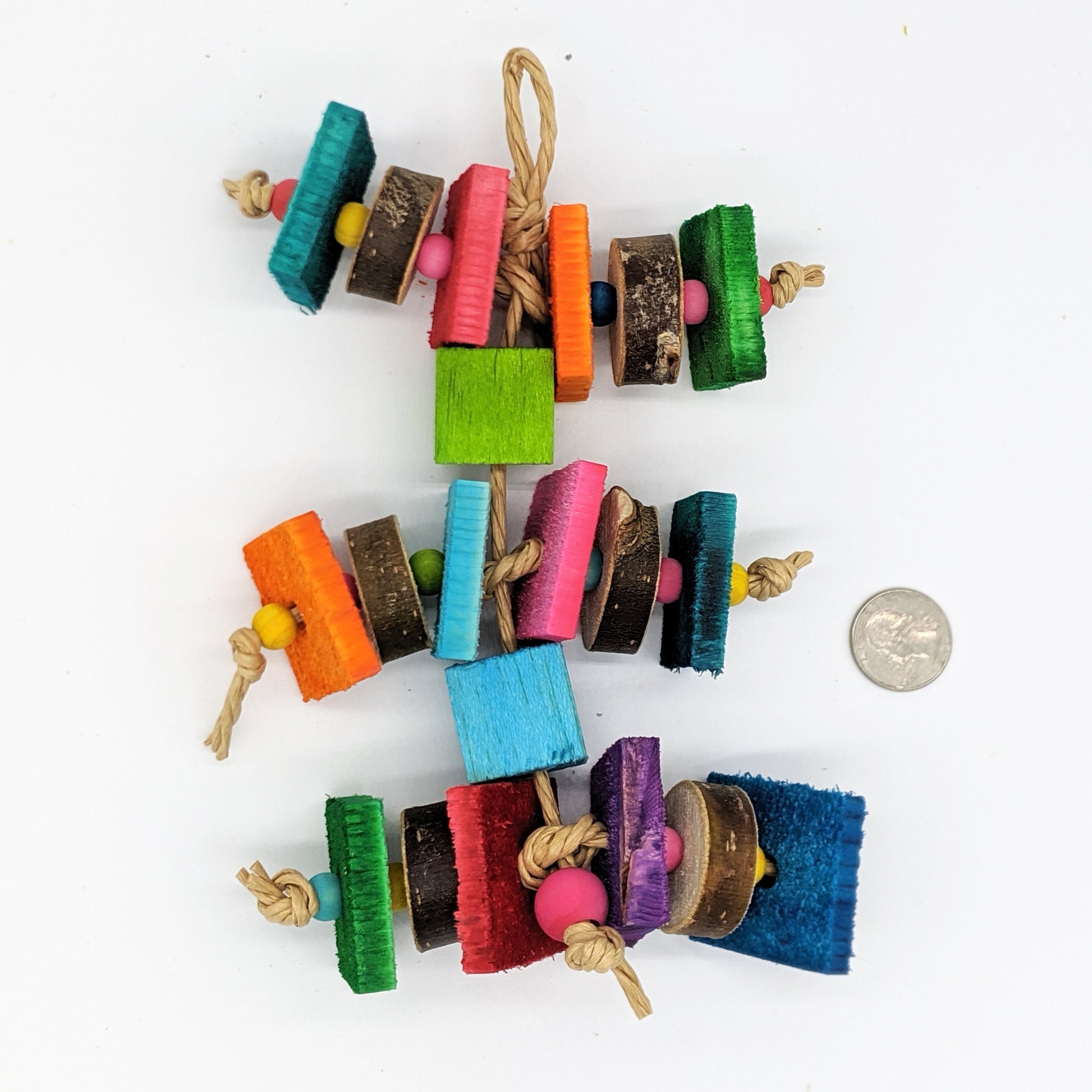 A bird toy for birds that love wood! Alternating pieces of 1/4" thin pine cut against the grain with pieces of natural willow or cottonwood slices. Wooden beads between the slices of wood, and balsa blocks between the levels of the toy.
