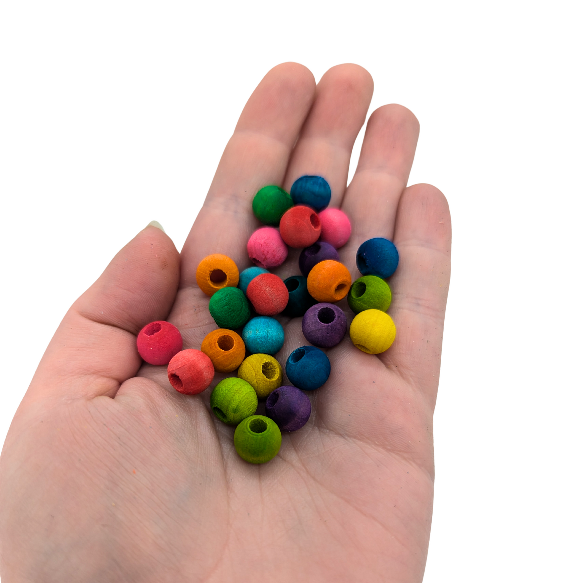 A set of 25 multicolored wood beads measuring 10mm, by Lil Monsters Bird Toys, shown in hand for scale
