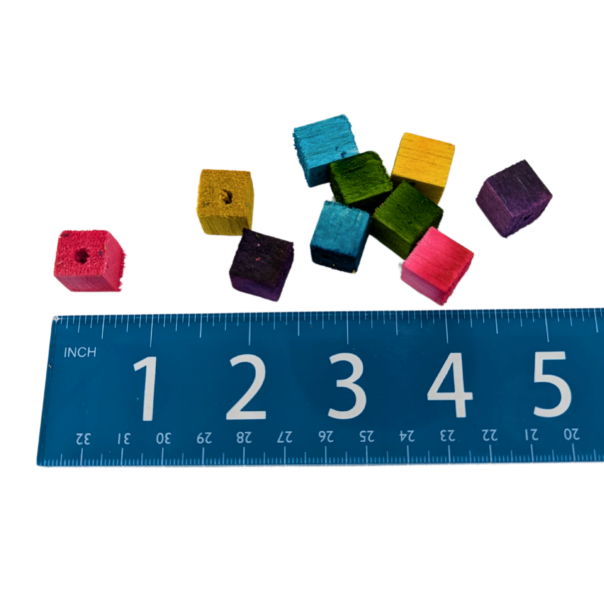 Mini half inch balsa cubes for toy parts, by Lil Monsters Bird Toys, shown next to ruler for scale