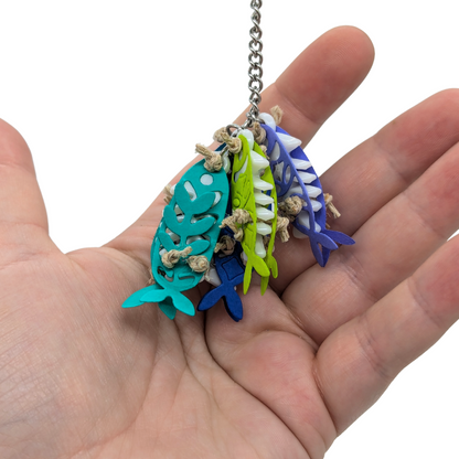 Catch of the Day small parrot toy by Tiny Conure Trinkets, in hand for scale