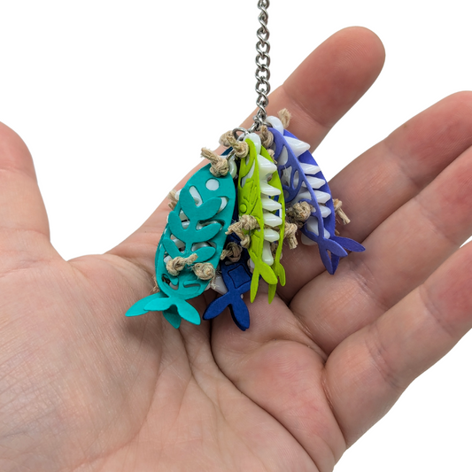 Catch of the Day small parrot toy by Tiny Conure Trinkets, in hand for scale