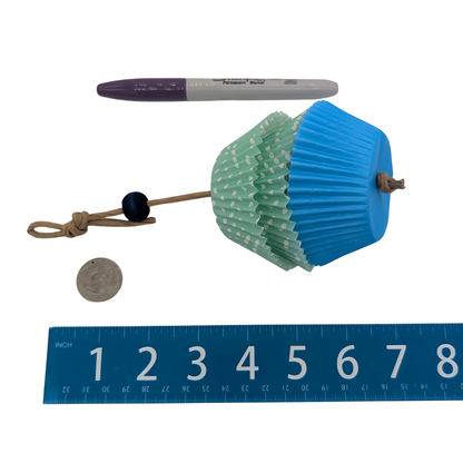 Cupcake Forager by Lil Monsters Bird Toys. Next to marker, US quarter, and ruler for scale. 