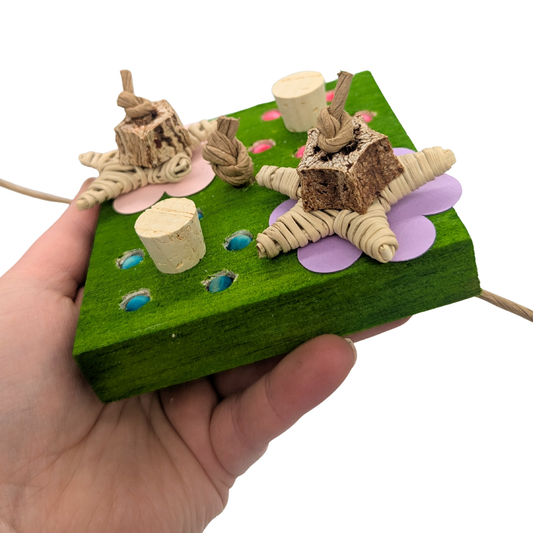 Dandy Parrot toy by Lil Monsters Bird Toys, held in hand for scale, side view