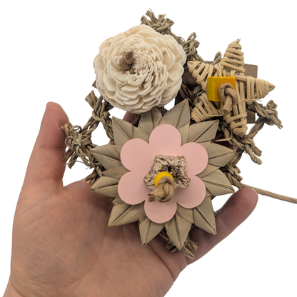 Floral Chic bird toy by Lil Monsters Bird Toys held in hand for scale, top view