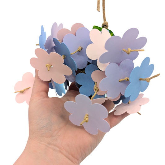 Flower Shower parrot toy by Lil Monsters Bird Toys, held in hand for scale