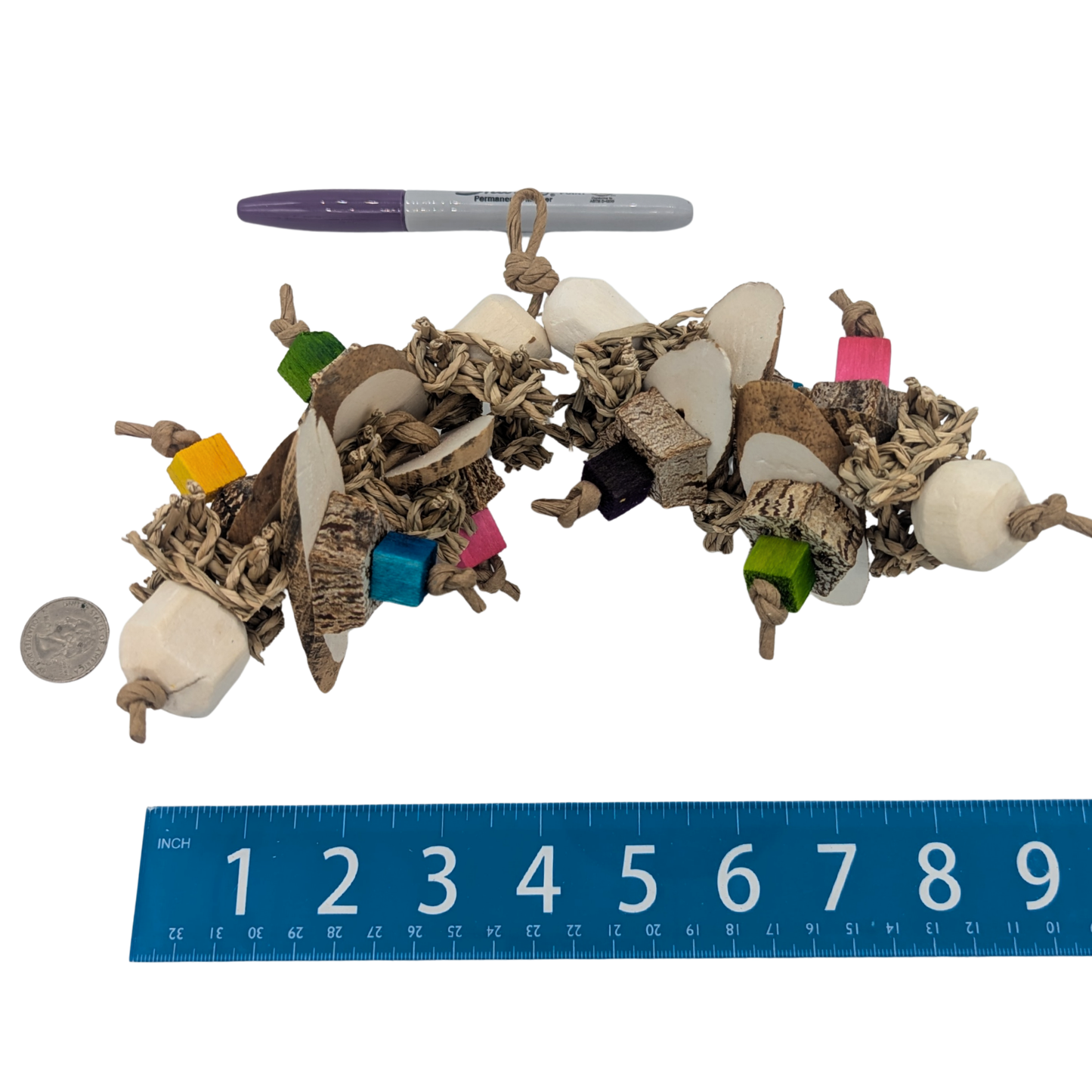 Frolic parrot toy by Lil Monsters Bird Toys, shown with a marker, ruler, and US quarter for scale