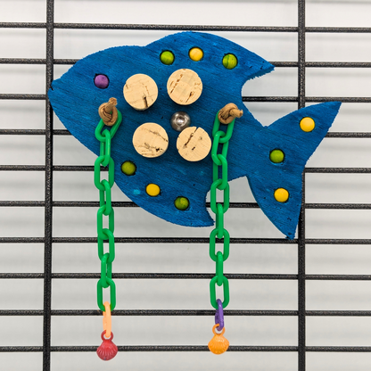 Gilligan foraging bird toy by Lil Monsters Bird Toys, shown on cage side to demonstrate hanging style