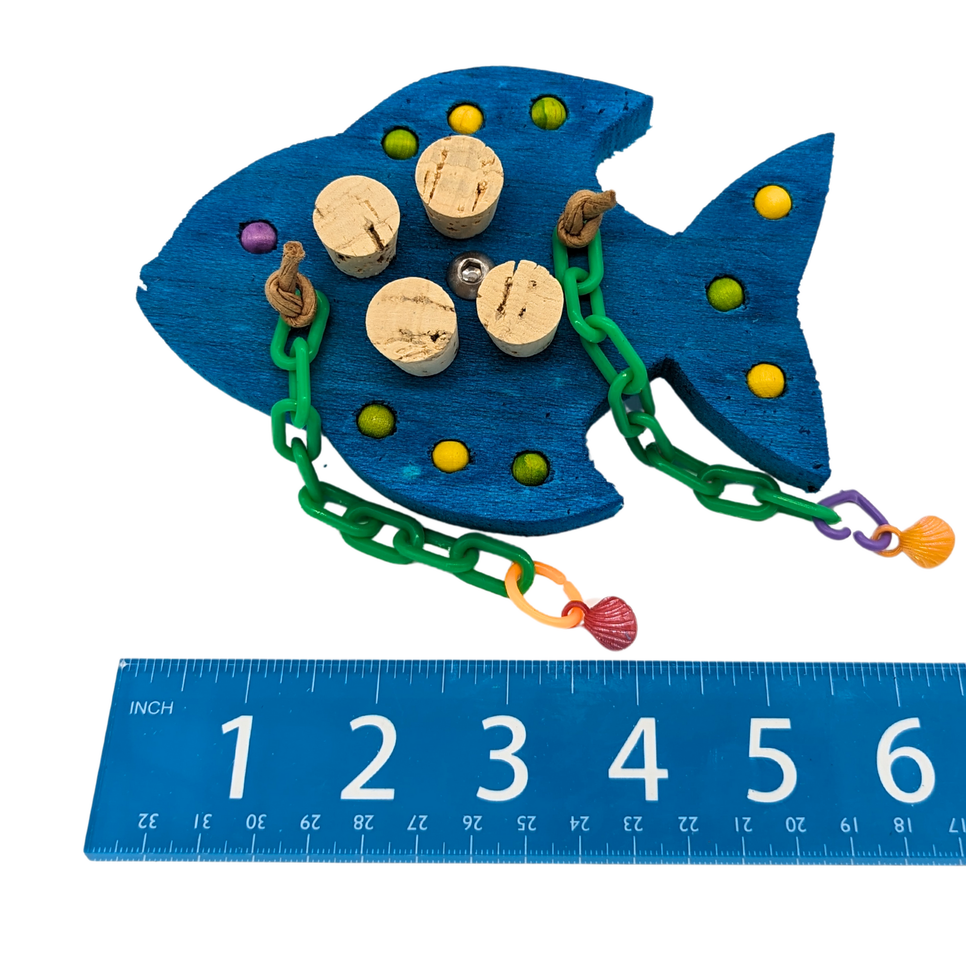 Gilligan foraging bird toy by Lil Monsters Bird Toys, next to ruler for scale