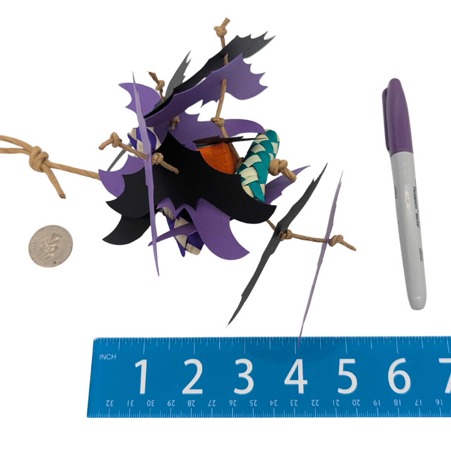 Mini Belfry Halloween Parrot Toy by Lil Monsters Bird Toys, next to a sharpie, ruler, and US quarter for scale