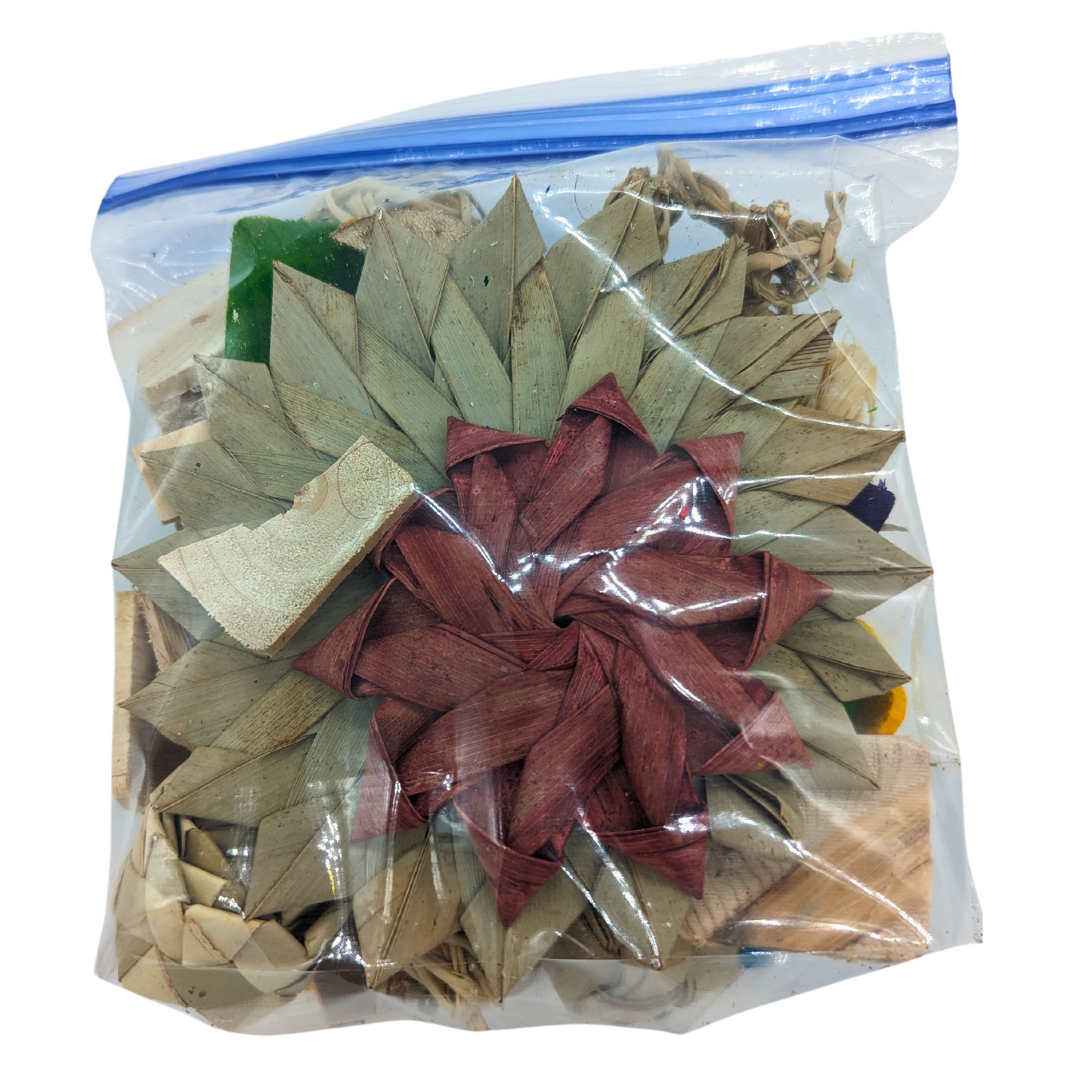 A bag of natural shred scraps, which could include palm, vine, seagrass, and more. By Lil Monsters Bird Toys