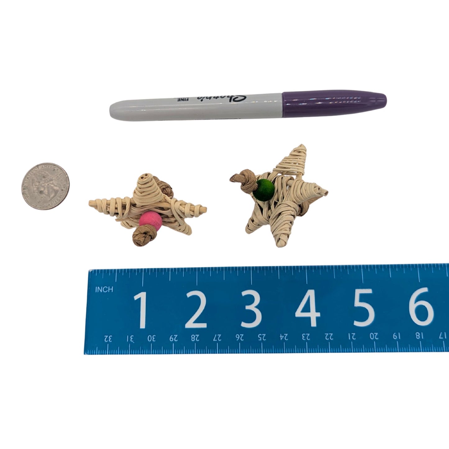 Oh My Star by Lil Monsters Bird Toys. Shown next to a US quarter, Sharpie marker, and ruler for scale. 