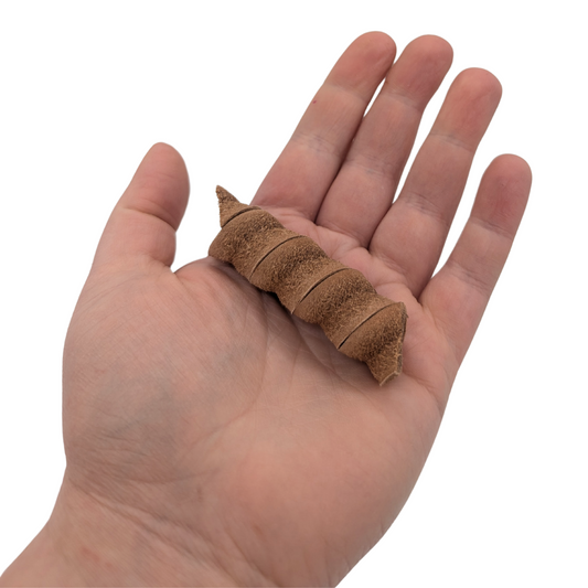 Rotini foot toy by Lil Monsters Bird Toys, held in hand for scale