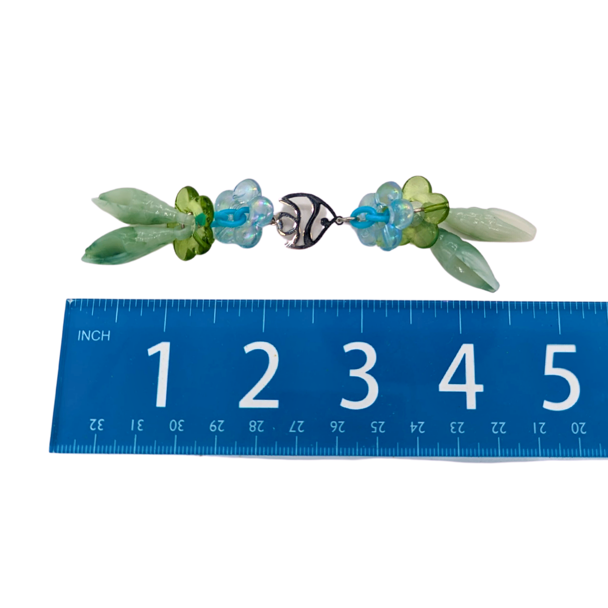 Seafoam bird foot toy by Tiny Conure Trinkets, next to ruler for scale