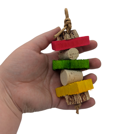 Sparrow small parrot toy by Lil Monsters Bird Toys, held in hand for scale