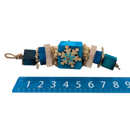 Squall winter themed bird toy by Lil Monsters Bird Toys, next to a ruler for scale
