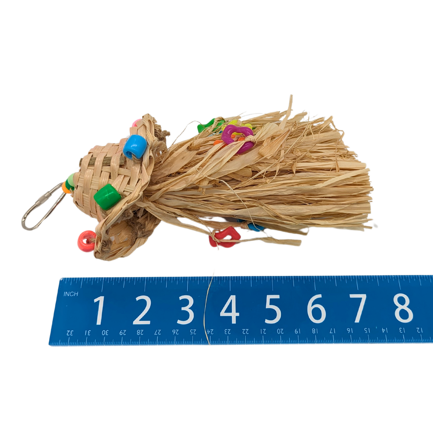 Straw Hat Preener bird toy by Super Bird Creations, next to ruler for scale