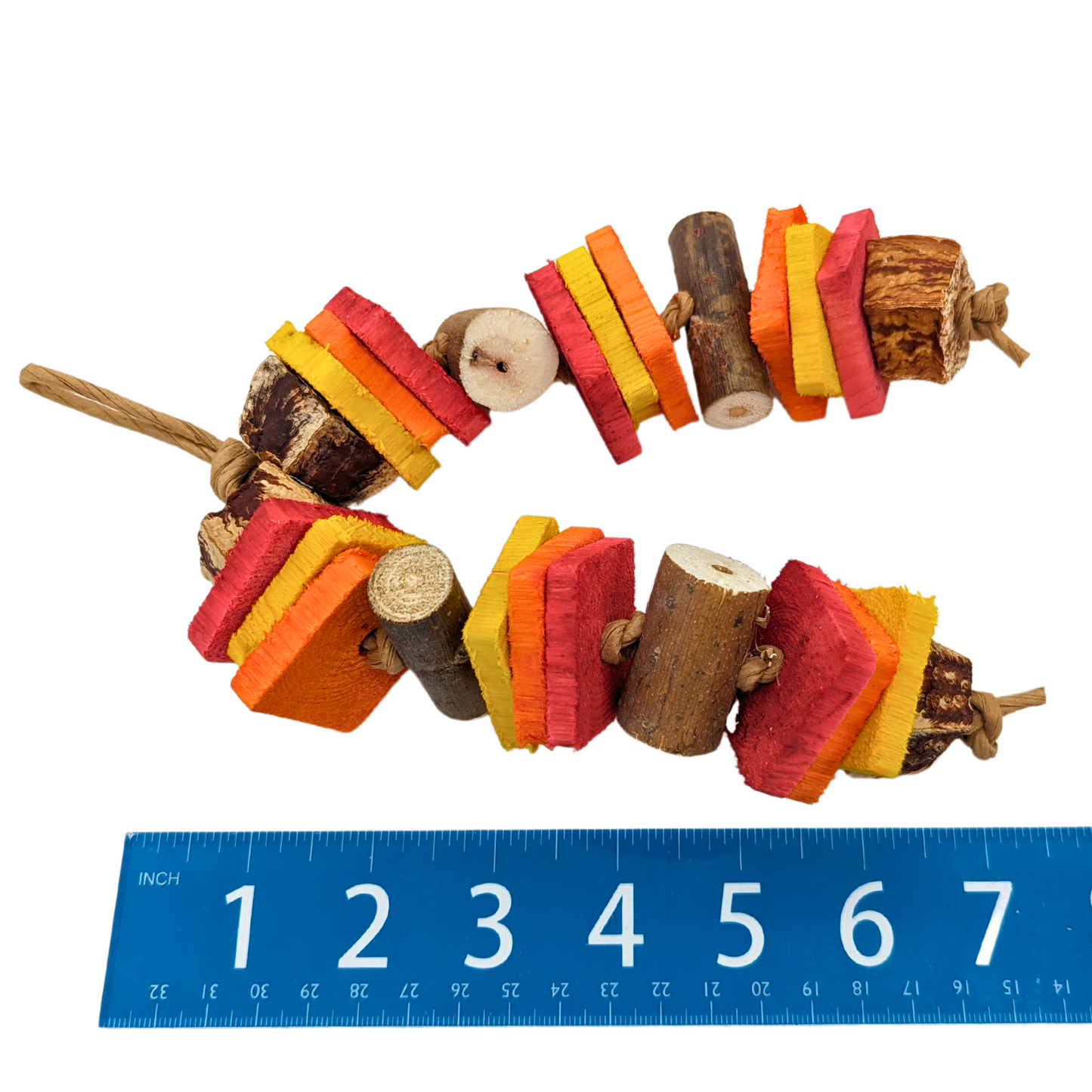 Ablaze, Summer Fire Themed Bird Toy by Lil Monsters Bird Toys, next to ruler for scale