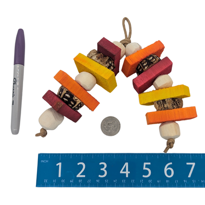 Antic by Lil Monsters Bird Toys. Shown next to a ruler, sharpie marker, and US quarter for scale. 