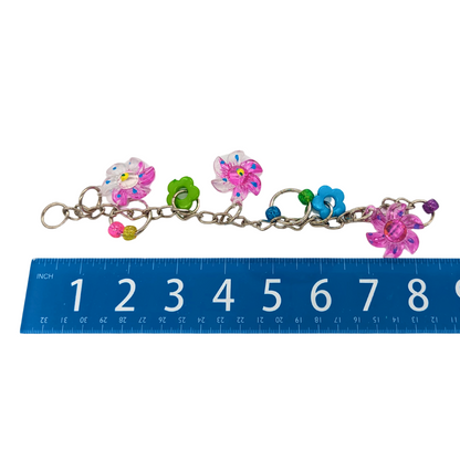 April Showers spring themed bird toy by Lil Monsters Bird Toys, shown next to ruler to show 8 inch length