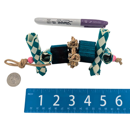 Argyle by Lil Monsters Bird Toys. Shown next to a ruler, US Quarter, and Sharpie marker for scale. Teal coloration. 
