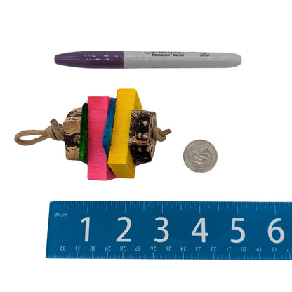 Baby by Lil Monsters Bird Toys. Shown next to a US quarter, sharpie marker, and ruler for scale. 