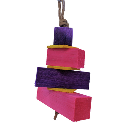 Balsa Birthday Cake by Lil Monsters Bird Toys. Made with layers of balsa and thin pine. Pink and purple color scheme. 