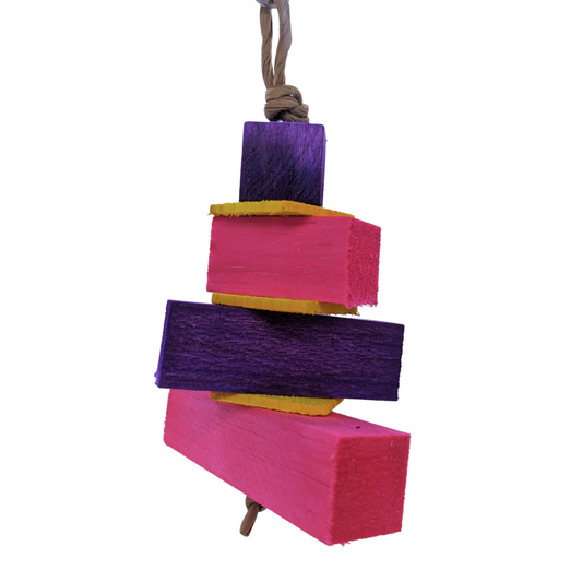 Balsa Birthday Cake by Lil Monsters Bird Toys. Made with layers of balsa and thin pine. Pink and purple color scheme. 
