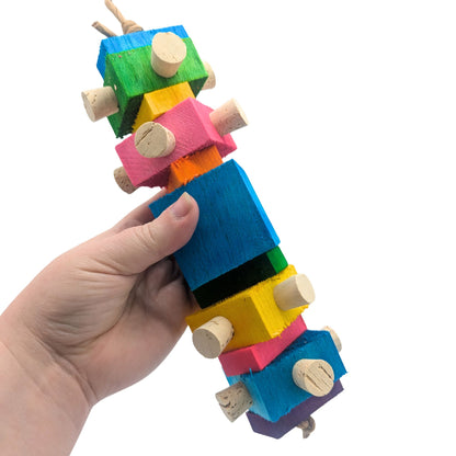 Balsa Spire by Lil Monsters Bird Toys. Held in hand to show scale. 
